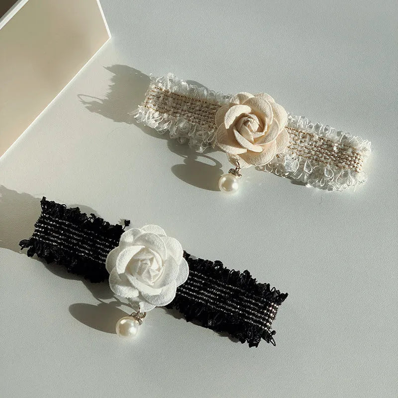 Magnolia flower pet collar accessory with chain in black on white background
