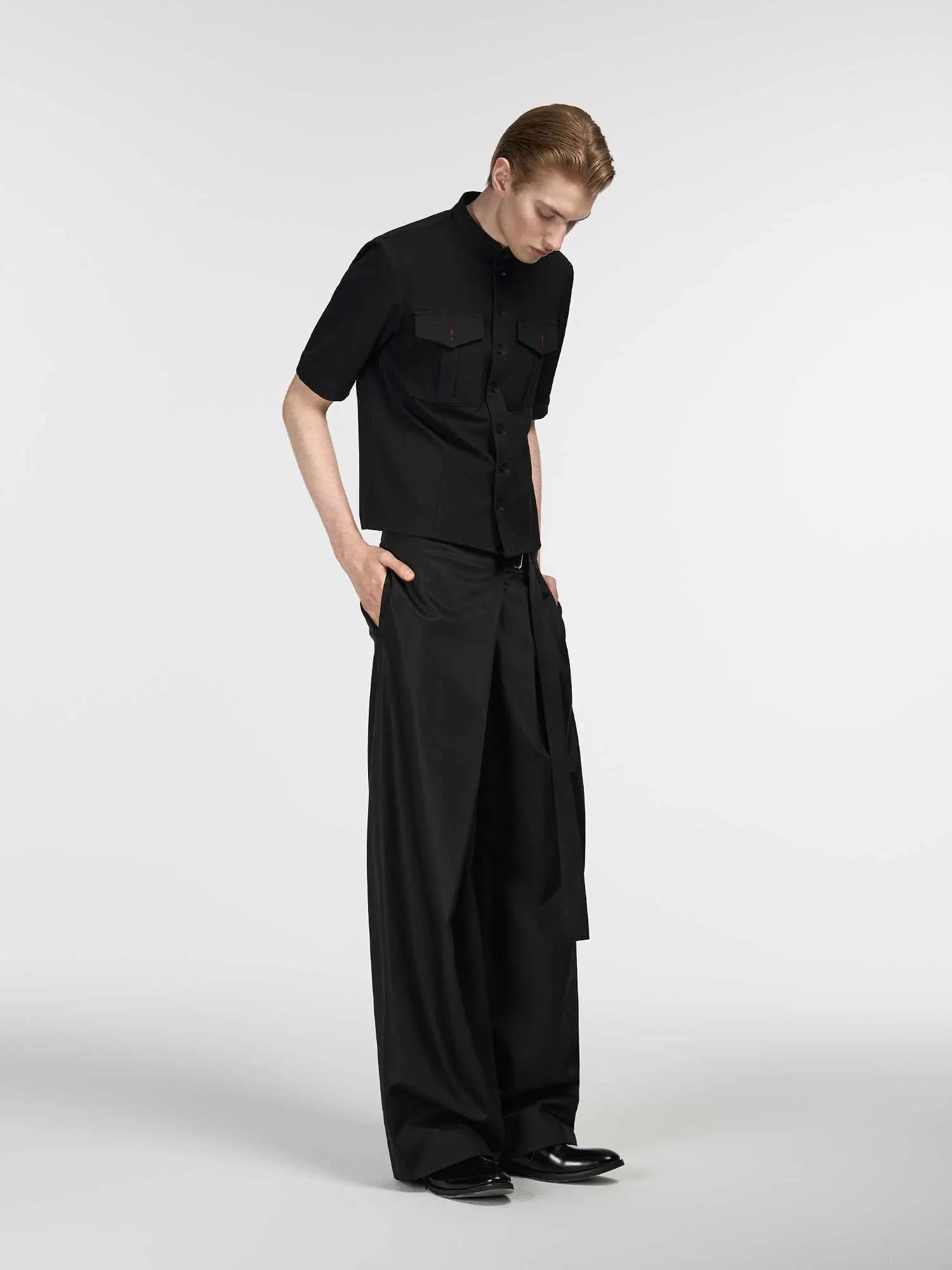 Black straight-leg trousers with adjustable waistband and single pleat detail