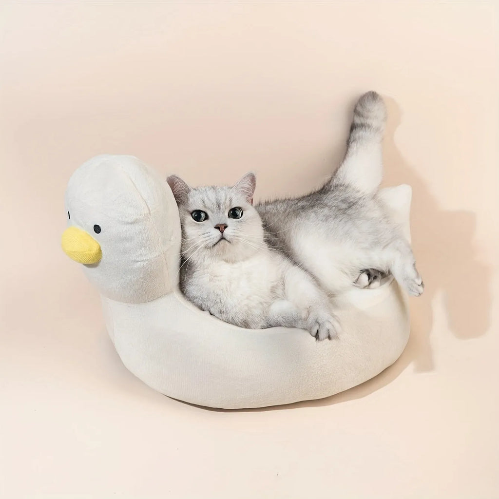 Blue duck-shaped soft polyester pet bed sofa for small dogs and cats on a wooden floor.