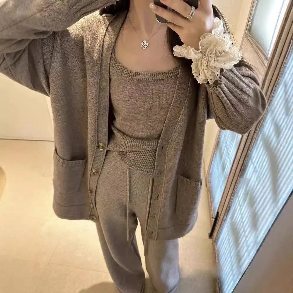 Women's light brown knit cardigan vest and suspender pants three-piece set laid flat