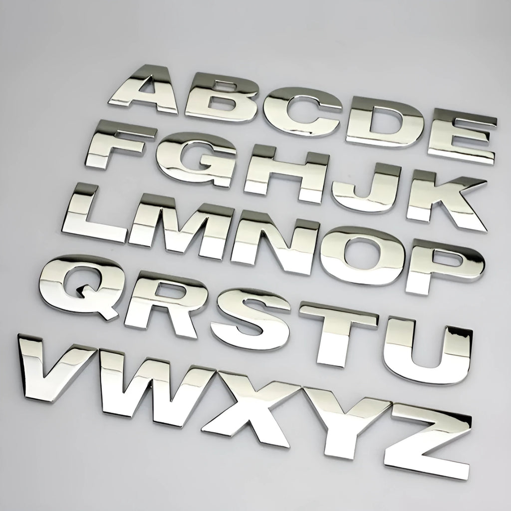 Close-up of a 3D metal zinc alloy car letter sticker in silver, showing its raised profile.