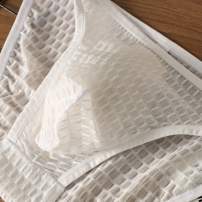 Men's low waist transparent underwear in nylon lace fabric showing breathable quick-drying design