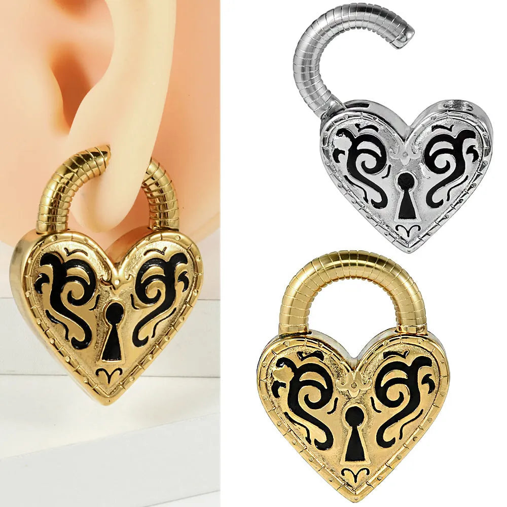 Close-up of a stainless steel heart-shaped earring with a gold-coloured electroplated finish.