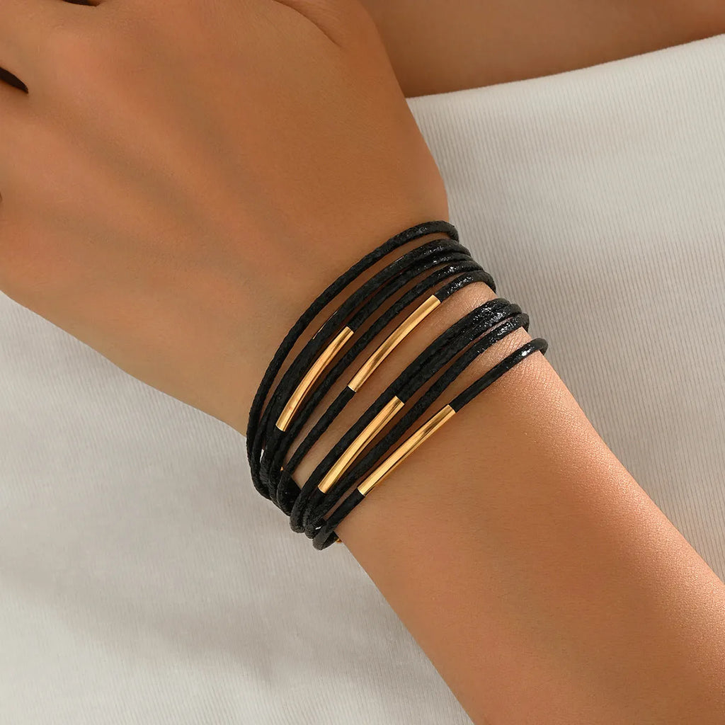 Multi-layer magnetic leather bracelet for women with round alloy element in gold, black, and coffee colours