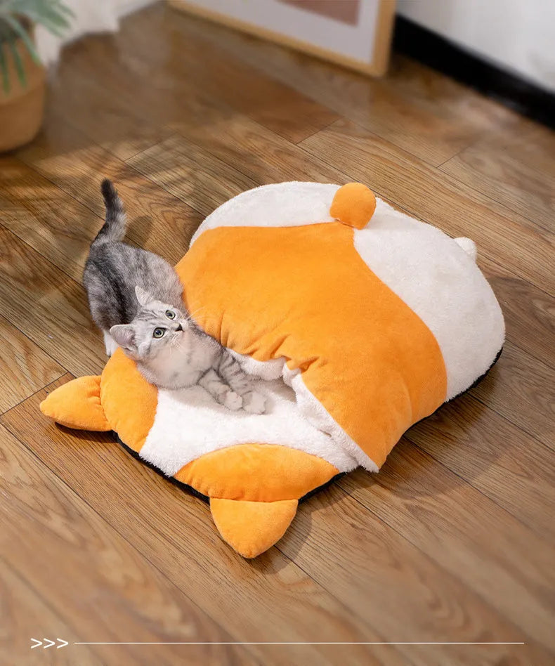 Orange semi-closed cat sleeping bag on a floor, showing its dimensions and sheltered design.