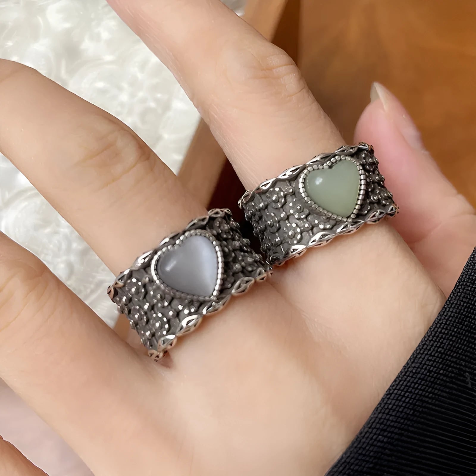 Adjustable opening love heart ring in white or green colour with retro wide-faced design
