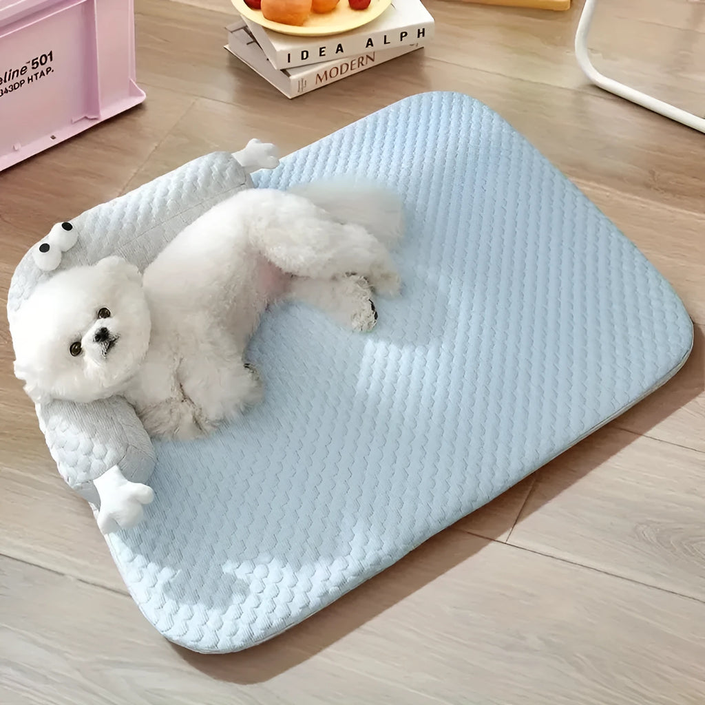 Blue big-eyed monster design non-slip pet cushion for dogs and cats on a wooden floor.