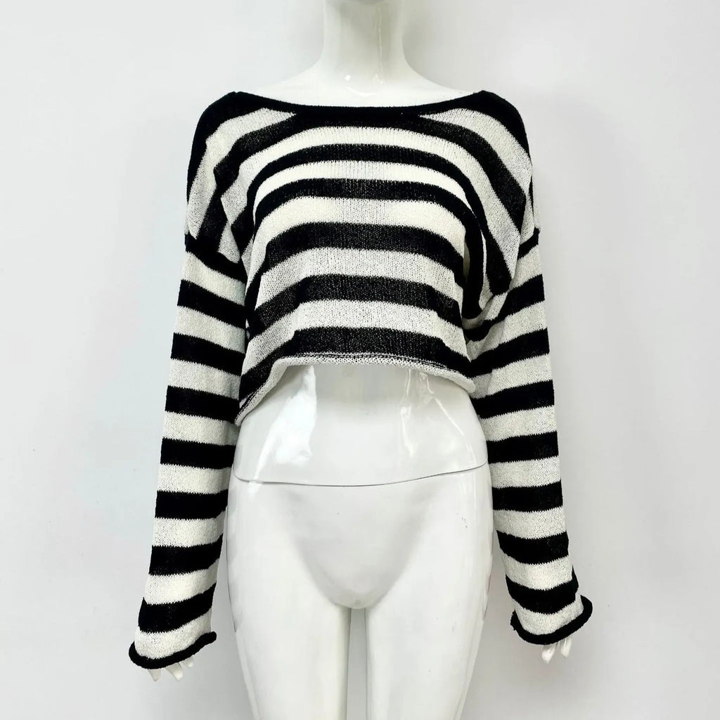 Woman wearing a striped long-sleeved sweater with an exposed navel, showcasing front and back wearable design in mercerised cotton.
