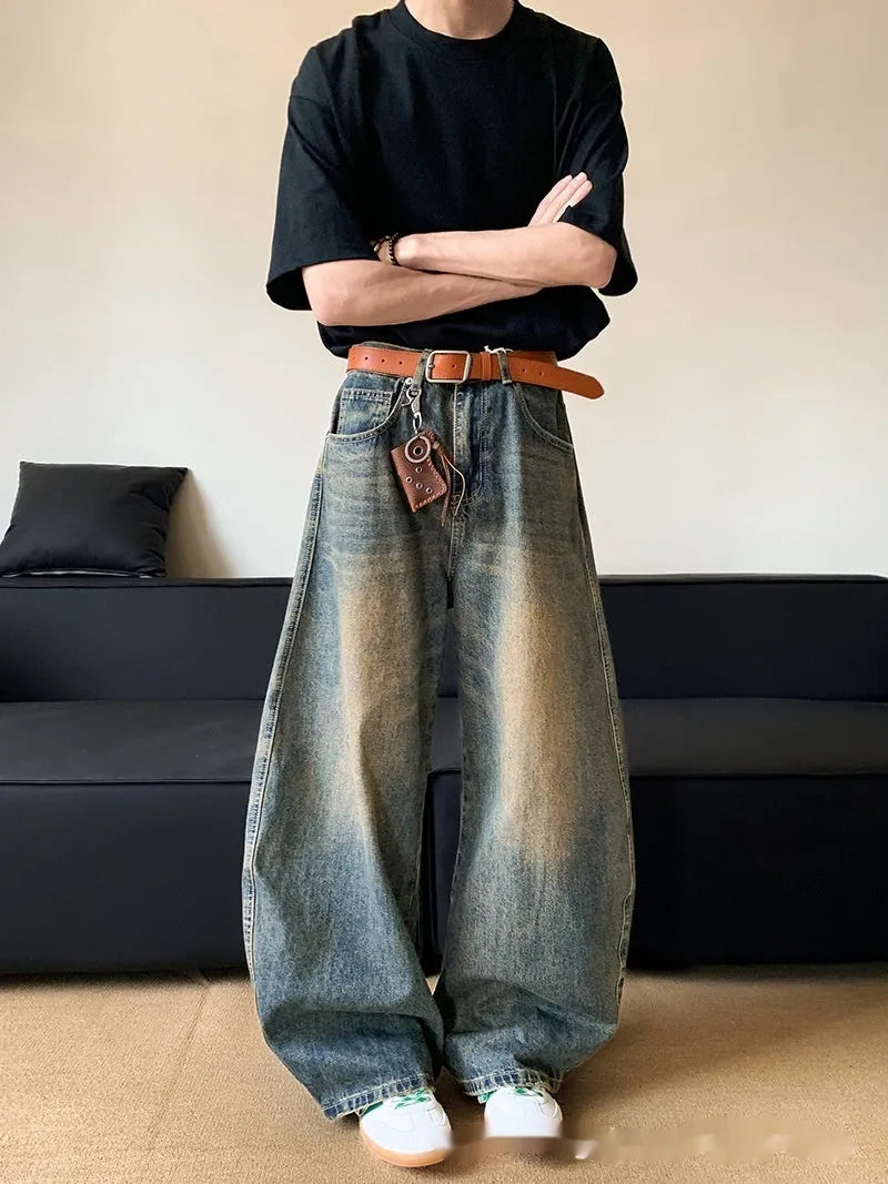 Men's retro blue distressed wide-leg jeans with micro-elastic cotton blend fabric showing distressed detailing