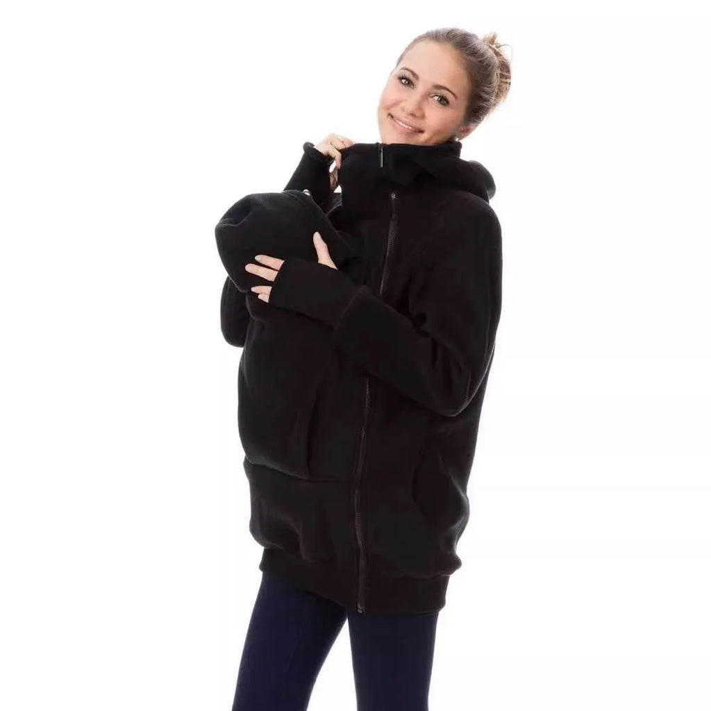 Red loose-fit women's polar fleece jumper with long sleeves on a hanger.