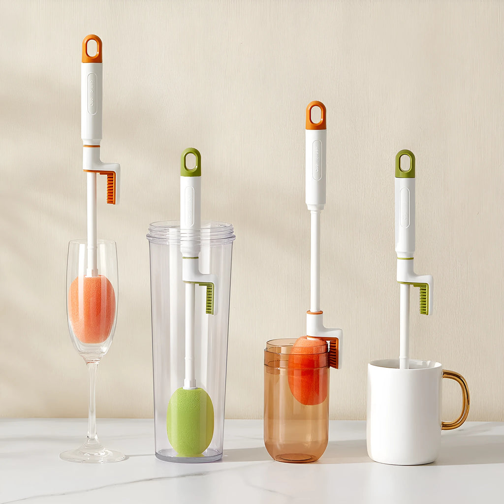 Long handle plastic cup brush in orange for cleaning tall bottles and cups