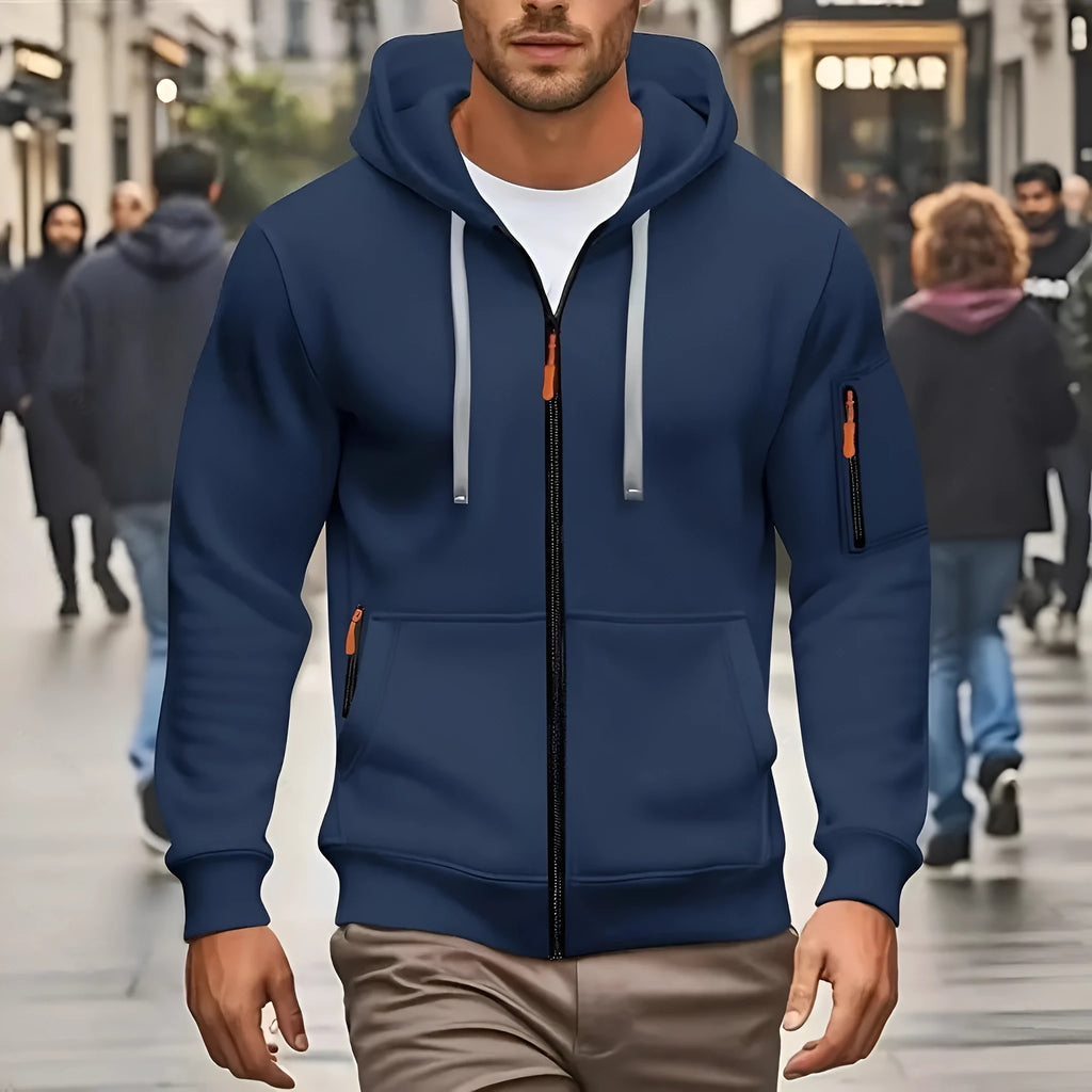 Man wearing a camel-coloured zip-up hooded cardigan coat with a wool lining.