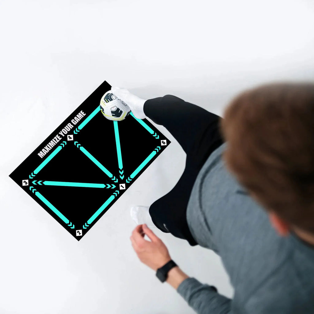 Black football training mat measuring 60x90cm with non-slip surface