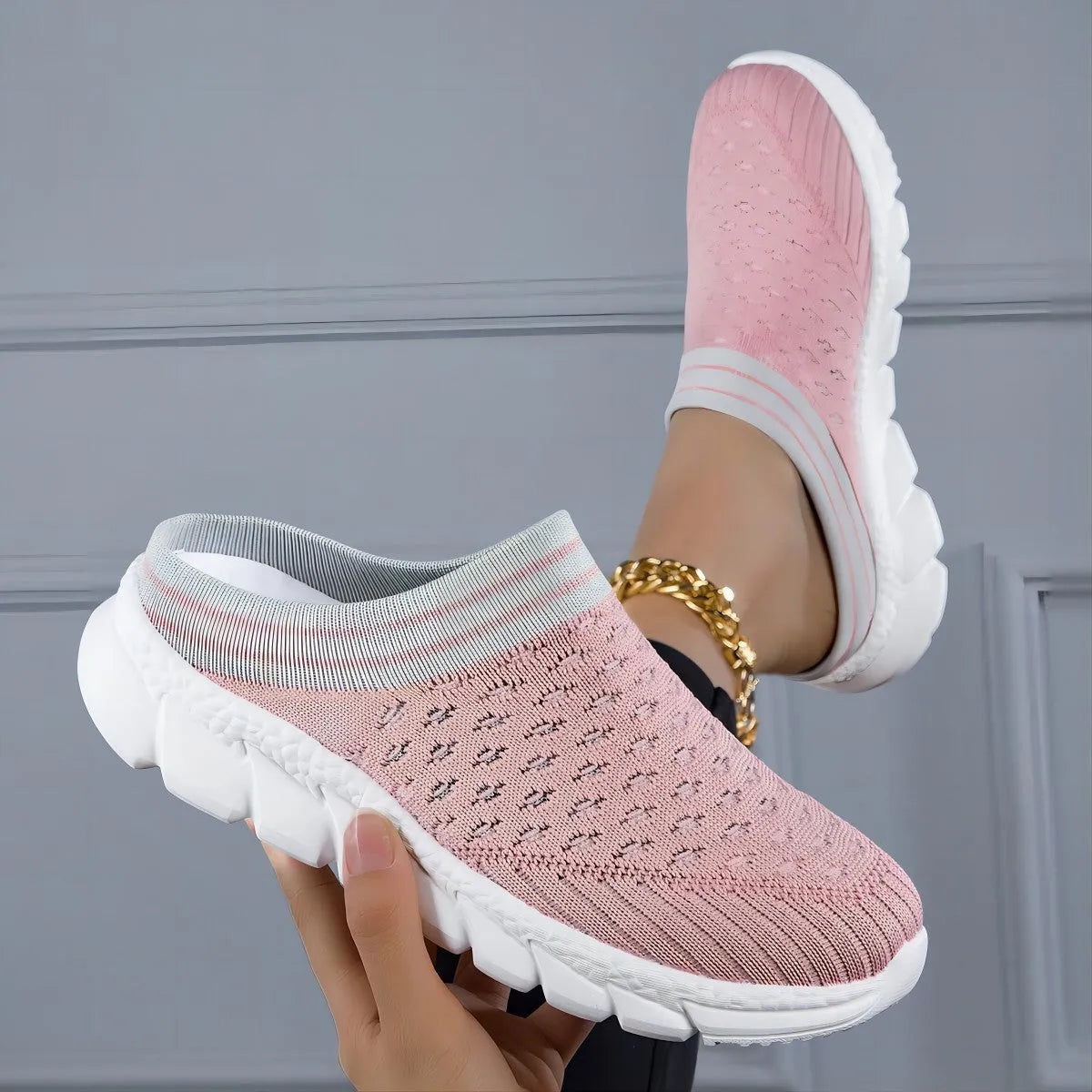 Women's black striped Flyknit slipper shoes with a height-increasing sole on a plain background