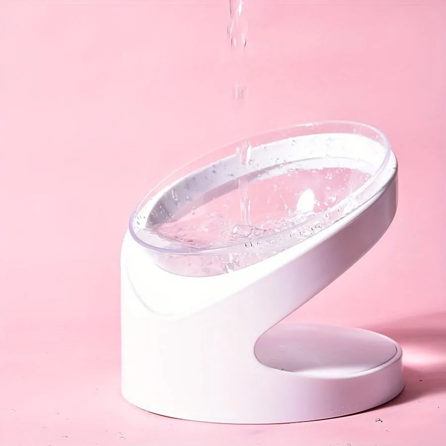 Clear plastic elevated cat food bowl with a tilted feeding platform.