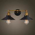 Black double head American retro industrial style iron wall lamp on a dark wall.