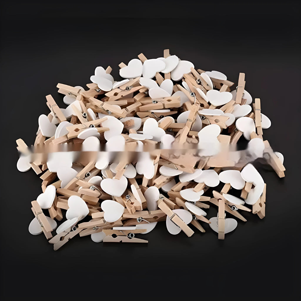 Set of five wooden heart-shaped clips in red, white, pink, yellow, and rose red colours.