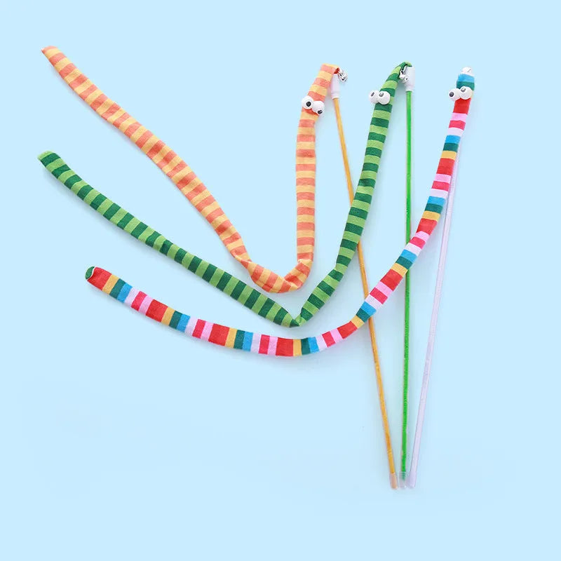 Cat wand toy with a polycarbonate pole and a long colourful plush strip with a bell, held in a person's hand.