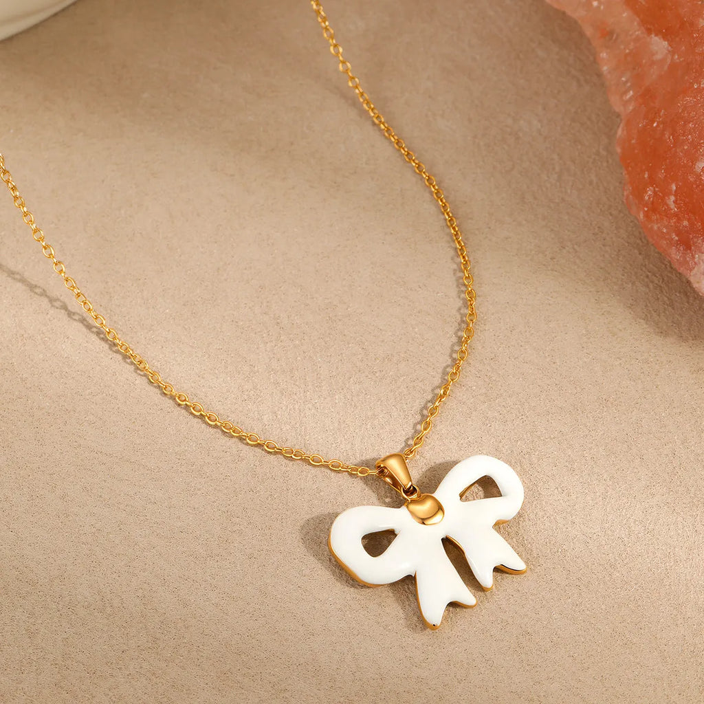 White bowknot pendant necklace on adjustable stainless steel chain 41-50cm length