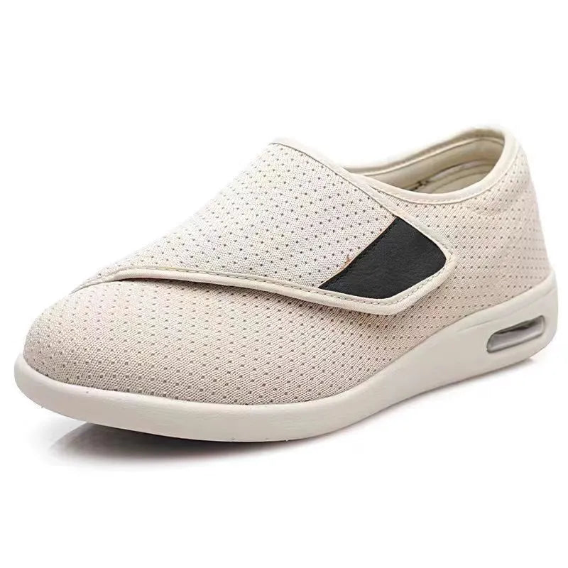 Casual beige leisure shoes with a velcro strap and round toe on a foam rubber sole.