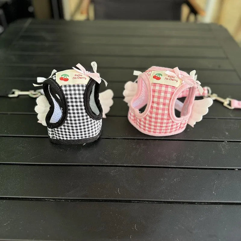 Small dog wearing pink cotton chest and back harness with integrated lead rope