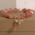 Women's pink strawberry quartz and freshwater pearl bracelet with zircon and alloy accents.