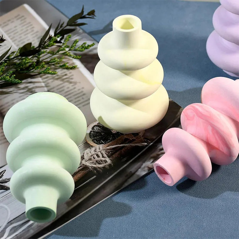Silicone mould for making three-layer circular vase ornament cakes in modern irregular shape.