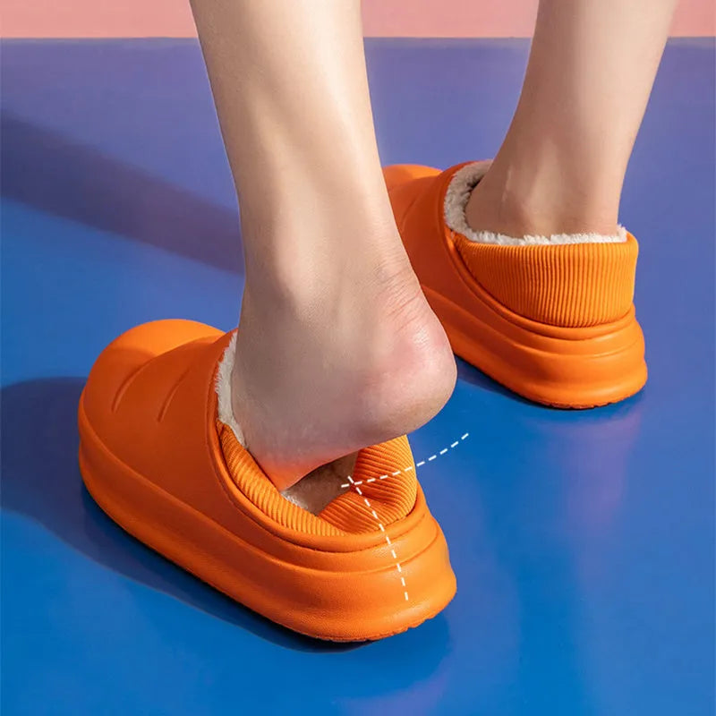 A pair of waterproof EVA couple slippers in various colours, showing plush lining and a non-slip sole.