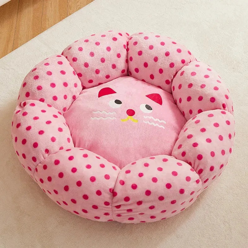 Pink dotted fabric cat bed shown in two circular sizes: 45cm and 65cm diameter.