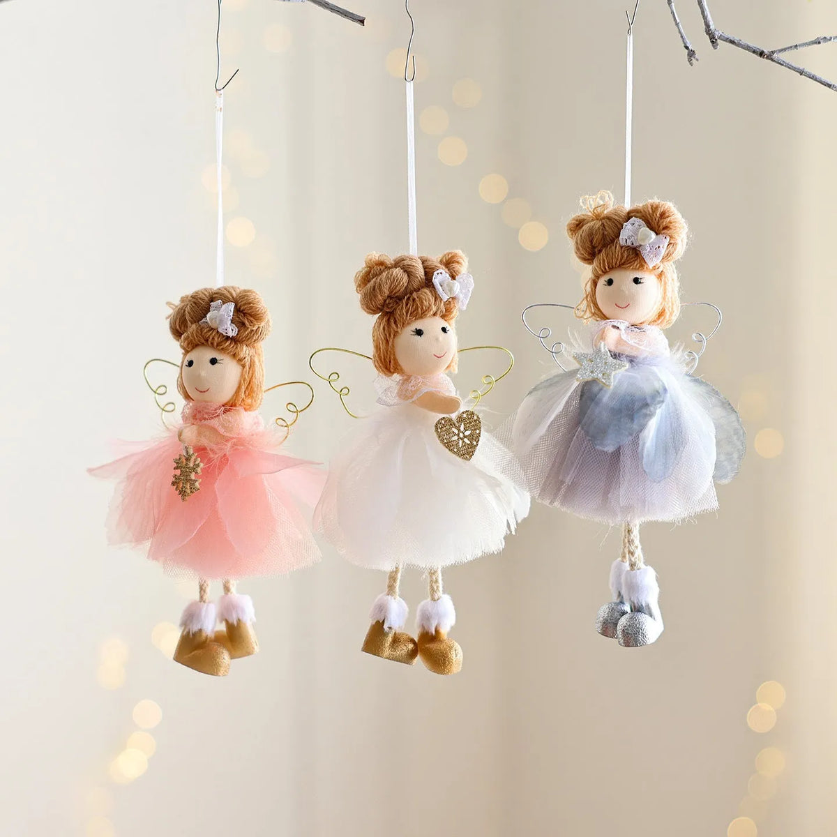 White Christmas tree hanging ornament with mesh angel girl design, snowflake styling, and metal, plastic, and cloth construction.