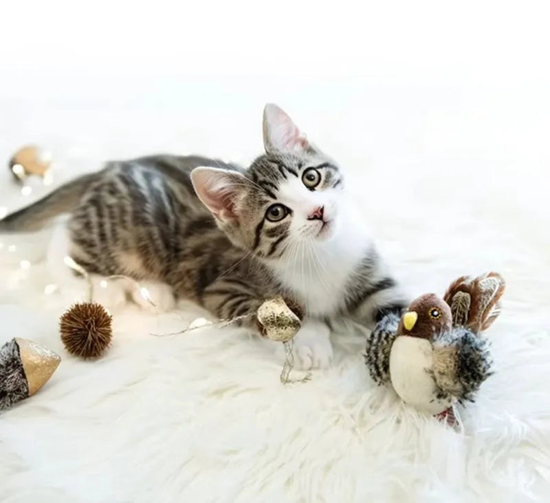 Interactive chirping bird cat toy made of velvet, 5.7x2.8x2.2 inches, with feather and ring for play.
