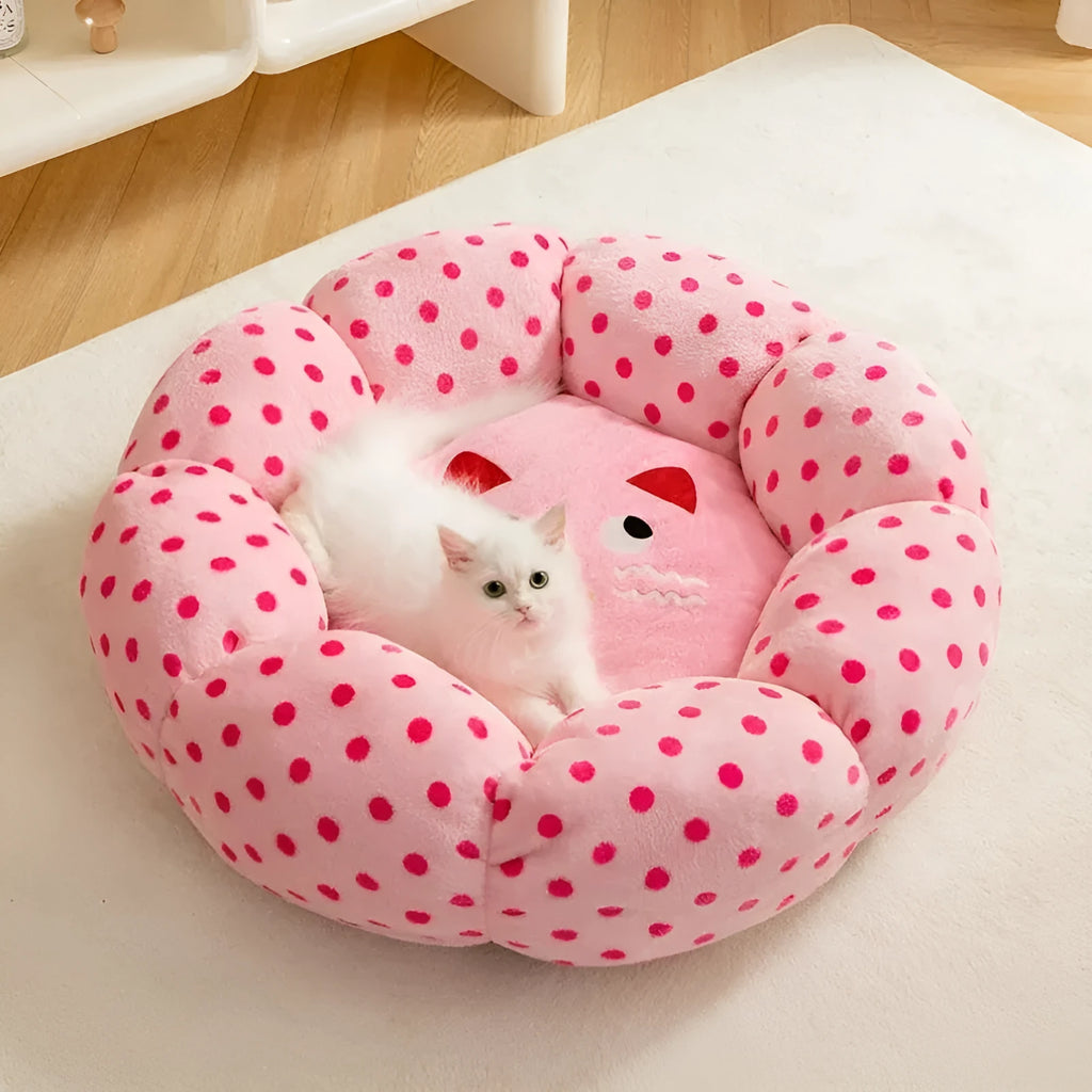 Pink dotted fabric cat bed shown in two circular sizes: 45cm and 65cm diameter.