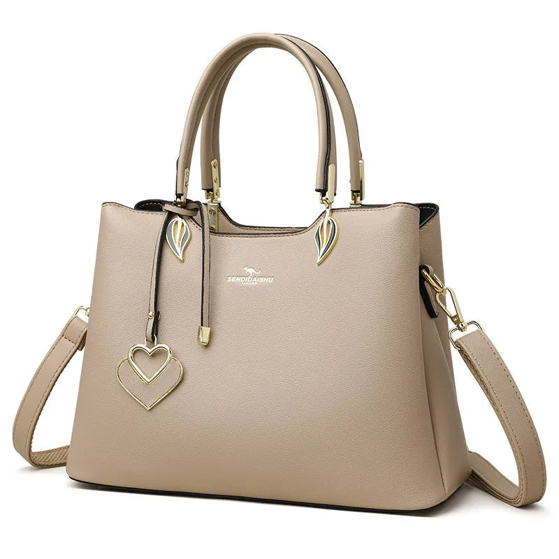 Women's black PU leather messenger bag with multi-layer shoulder design and sewing thread detailing