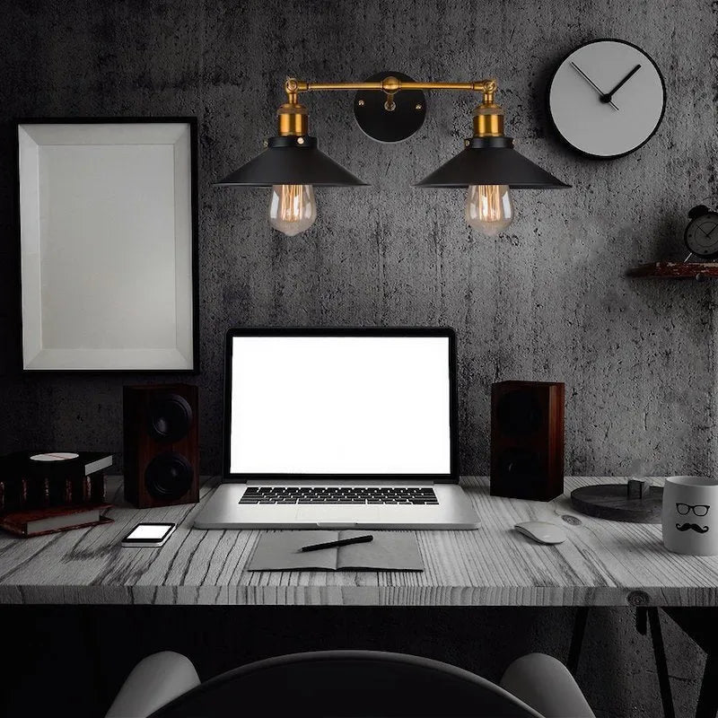 Black double head American retro industrial style iron wall lamp on a dark wall.