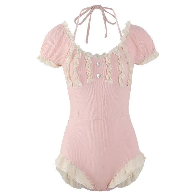 Women's pink conservative one-piece swimsuit with Siamese styling in nylon fabric
