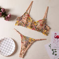 Floral mesh bra with steel ring T-back and coordinating briefs in various colours.