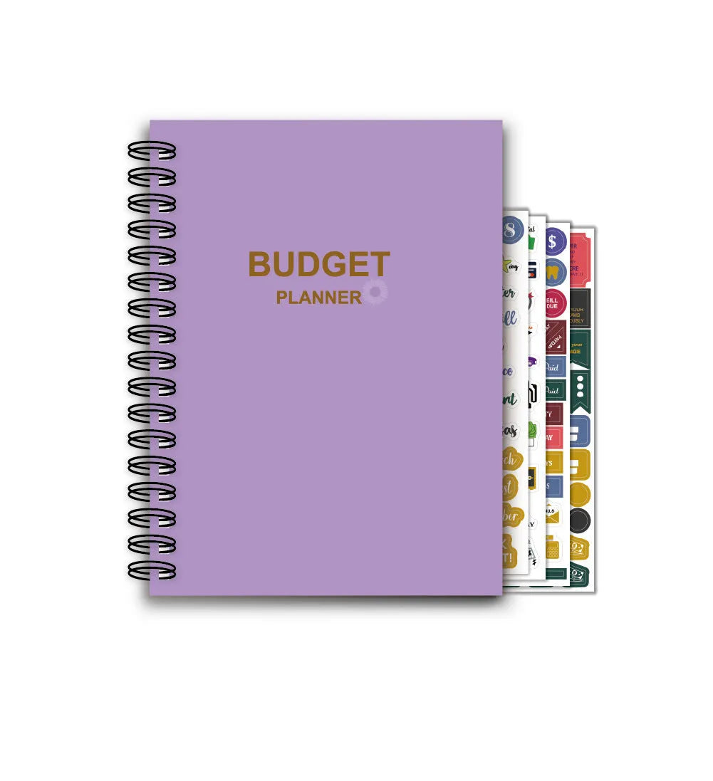Purple coil-bound budget book with stickers and paper clips for monthly financial planning