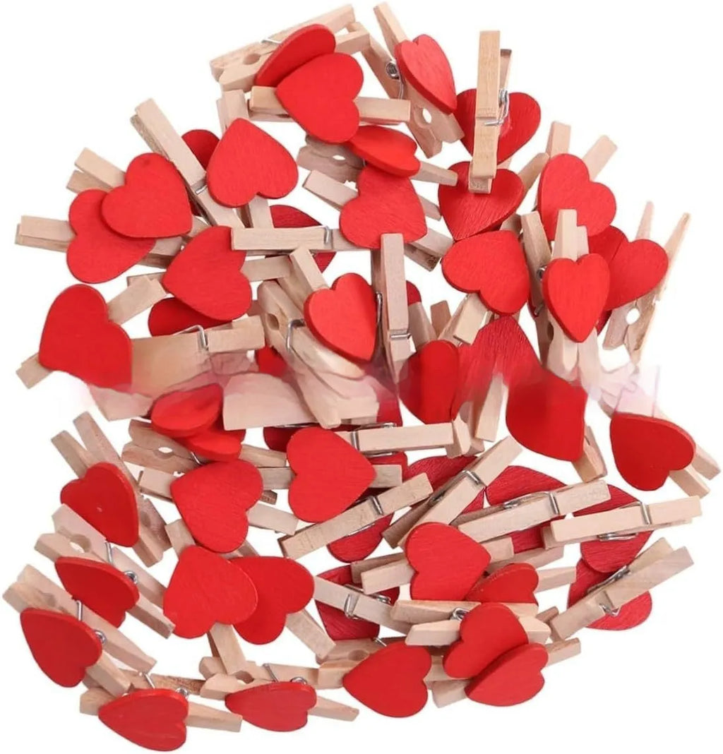 Set of five wooden heart-shaped clips in red, white, pink, yellow, and rose red colours.