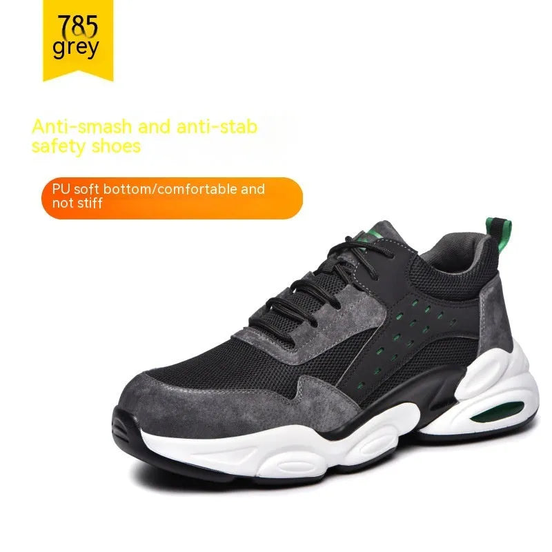 Men's black mesh safety work shoes with anti-smash sole on grey industrial background.
