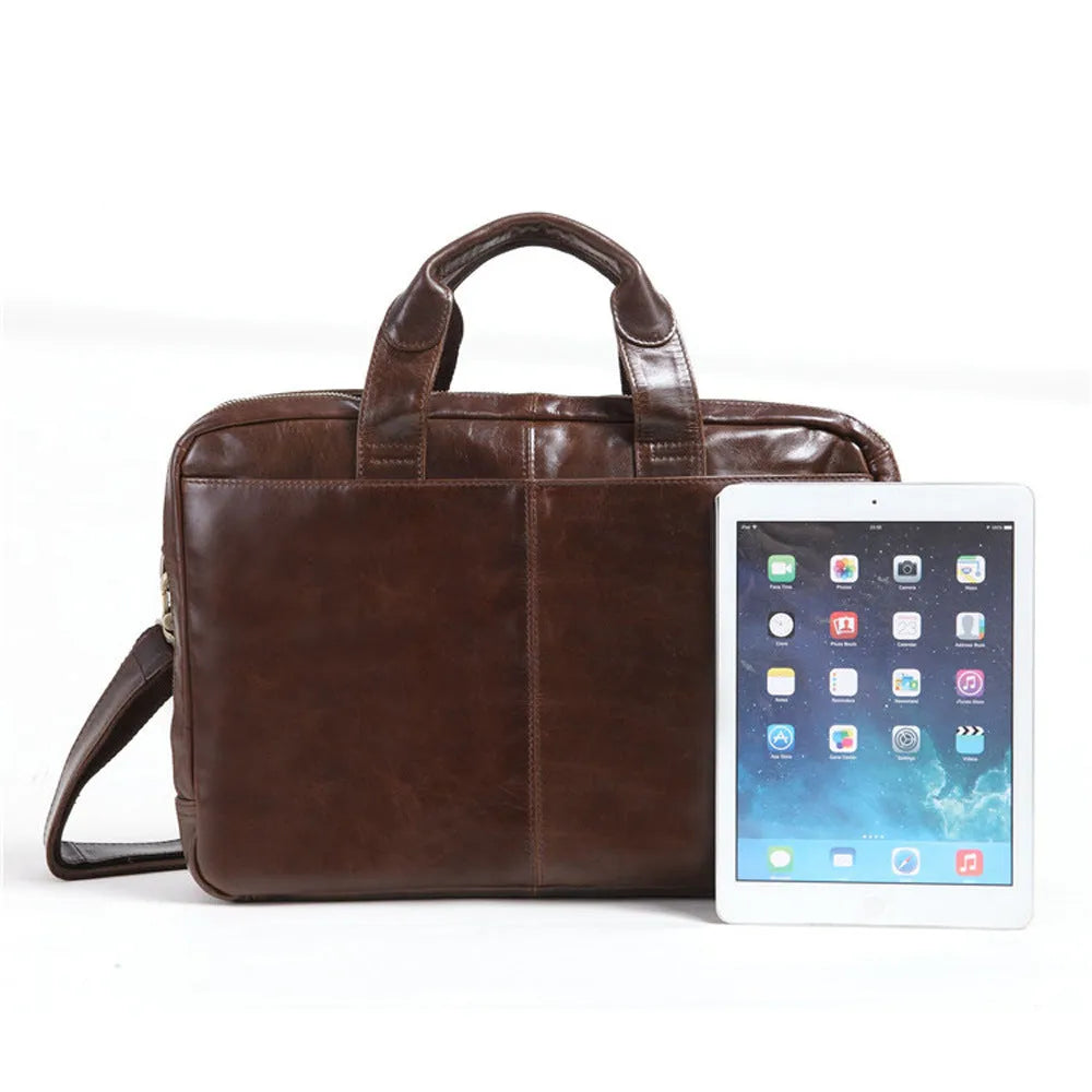 Brown men's first layer cowhide business briefcase 18 inch laptop bag on table