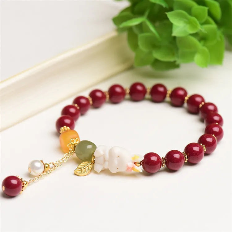 Natural cinnabar rabbit bracelet in national style design showing 8mm and 10mm size options