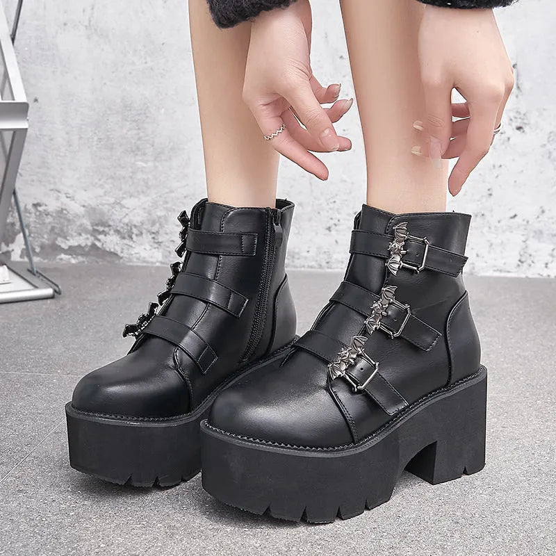 Black women's punk-style short Martin boots featuring a bat buckle, side zipper, and thick heel