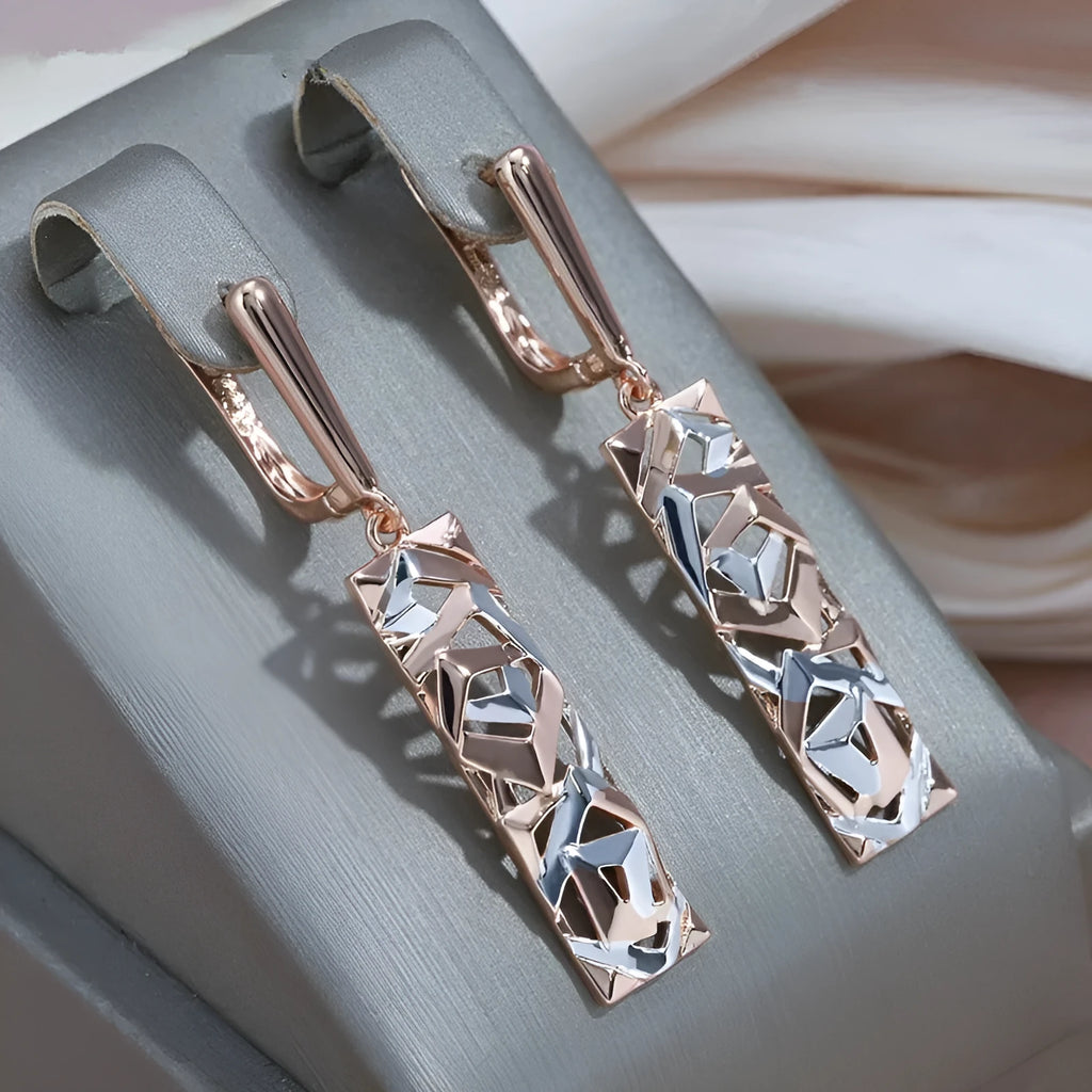 A pair of rectangular two-tone hollow stud earrings with a geometric design and picture-style colour finish.