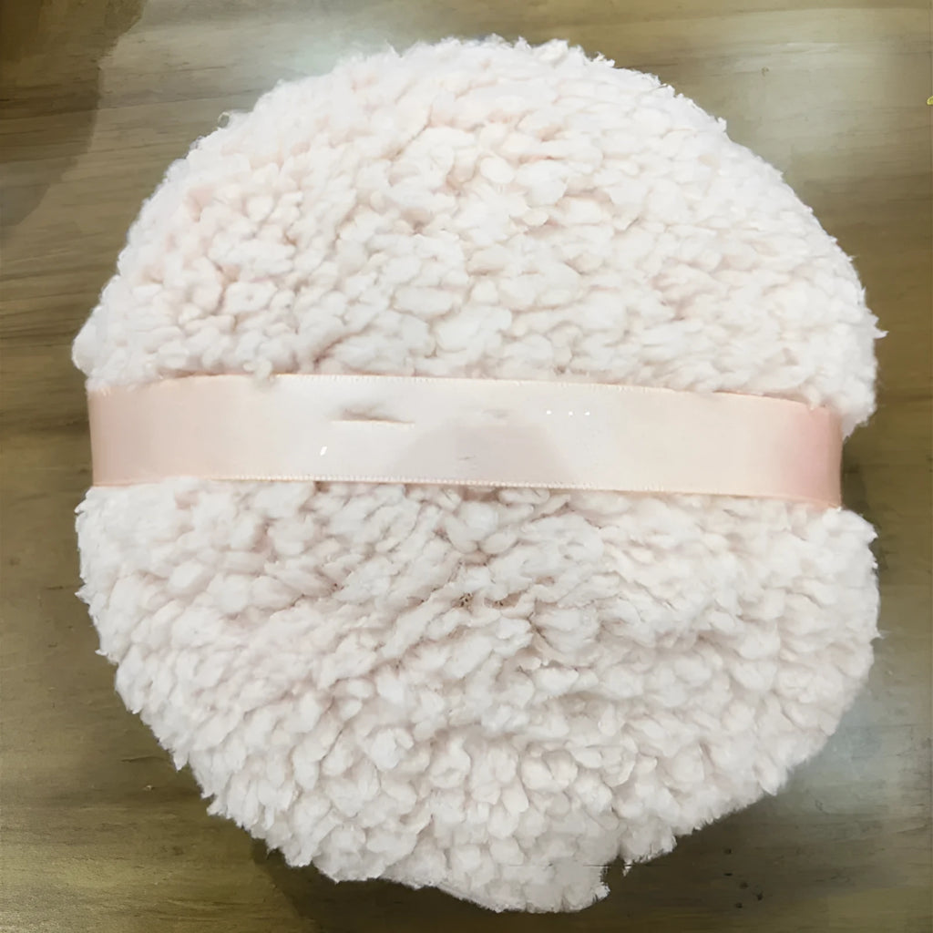 Oversized rectangular plush powder puff in pink, white, or skin colour on white background.