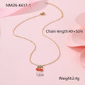 Cherry design jewellery set with gold plated necklace, bracelet, earrings, and ring on a flat surface.