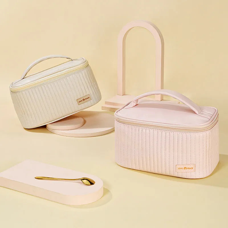Cake-shaped open-top women's makeup bag in PU leather, shown in a solid colour from the available range.