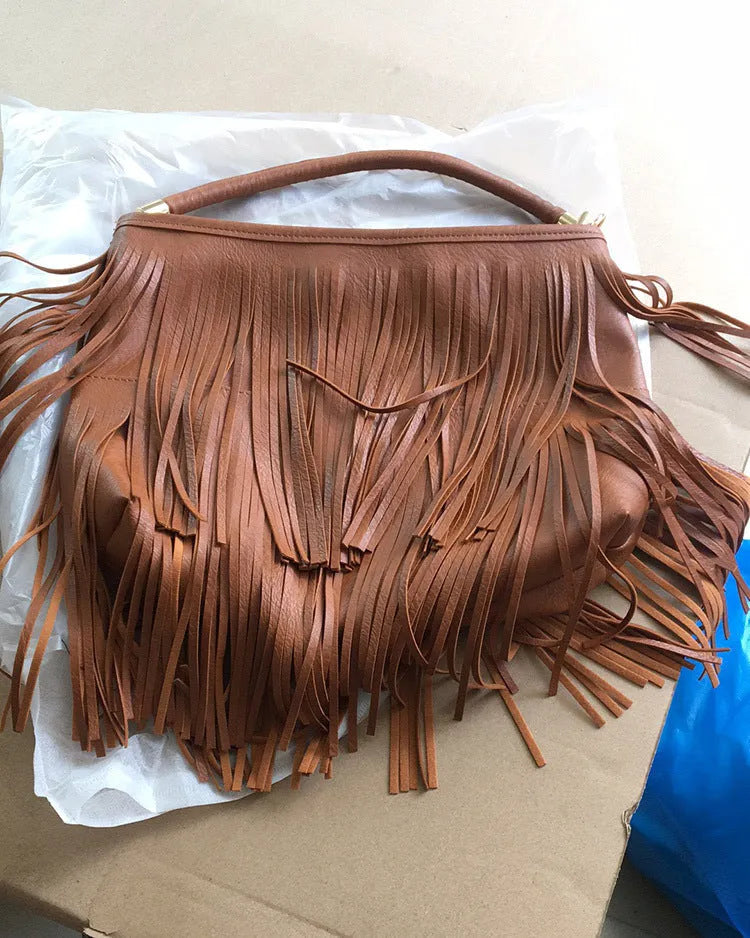 Double-sided tassel handbag in black or brown PU, 33cm wide, 29cm high, 6cm thick, with adjustable 124cm strap.