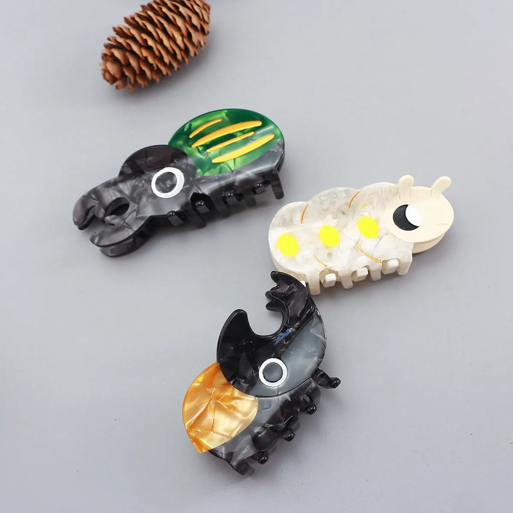 Handmade acetate beetle grip sheet with insect biology design for specimen display