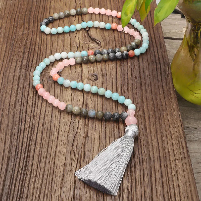 Bohemian 108 colourful stone necklace with drop-shaped tassel pendant on white background