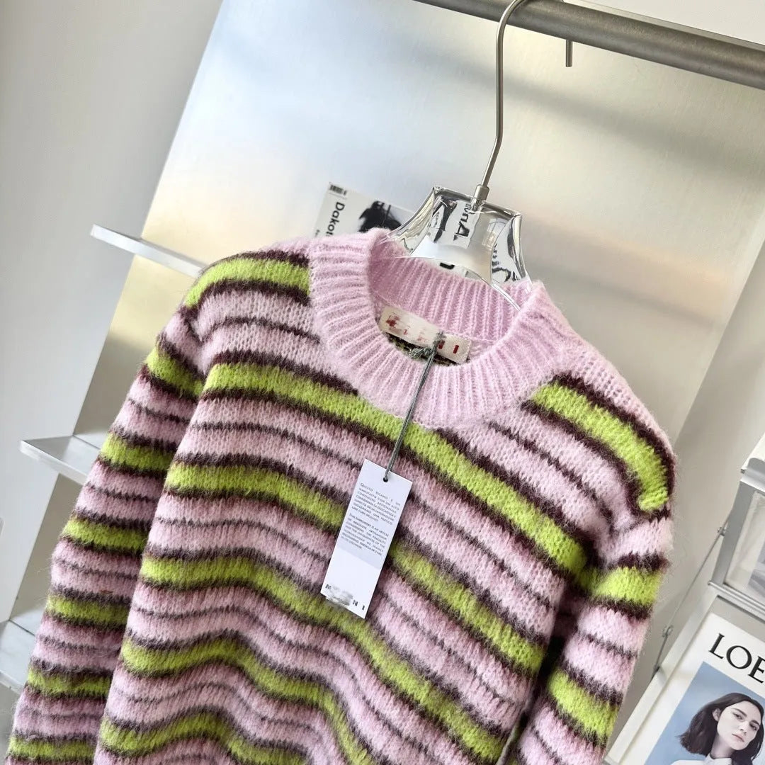 Pink wool knitted cardigan sweater with round collar on a hanger